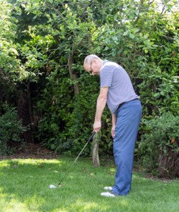 You will stand closer to the ball with a short iron.